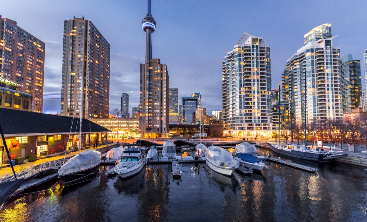 Boats moored at a Toronto harbourfront marina at dusk